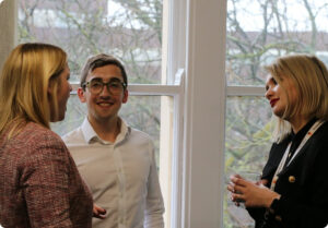 photo of Jack Deverson discussing with two other people