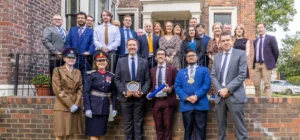 photo of Evidence Based Education team at the King's Award ceremony outside their office